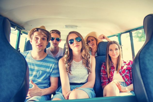 Group of young people in the back of a minivan