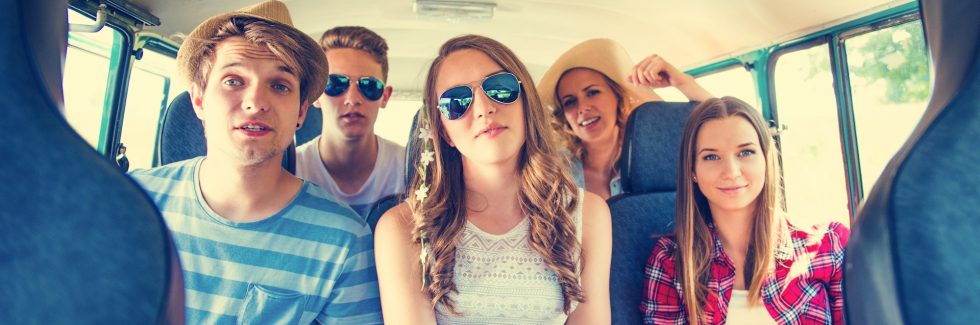 Group of young people in the back of a minivan